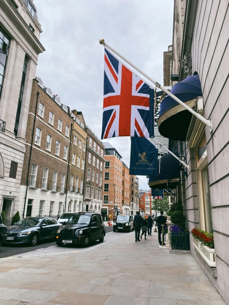 Street view in London with Union Jack flag and classic architecture.